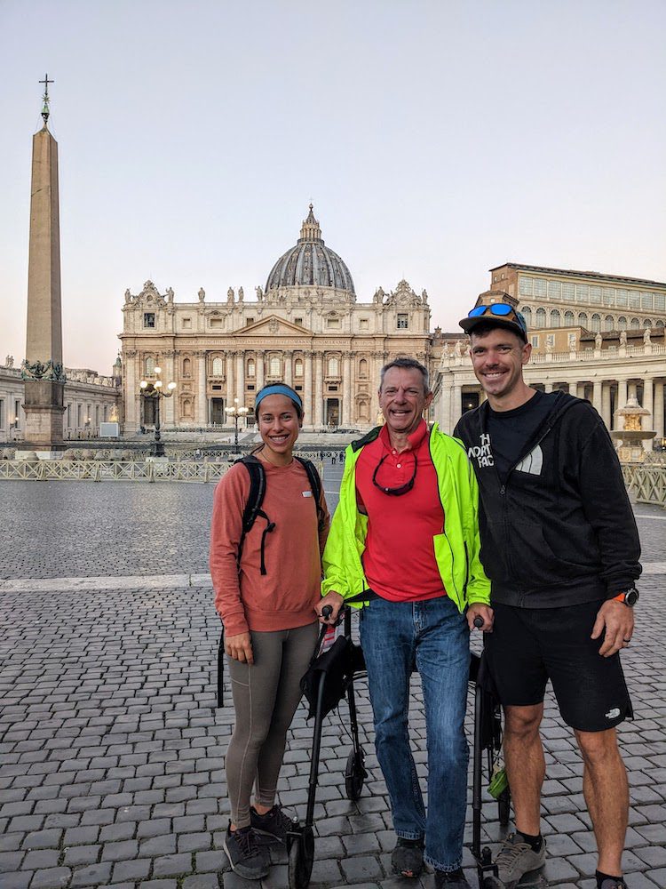 three people outside the Vatican in Rome, Italy