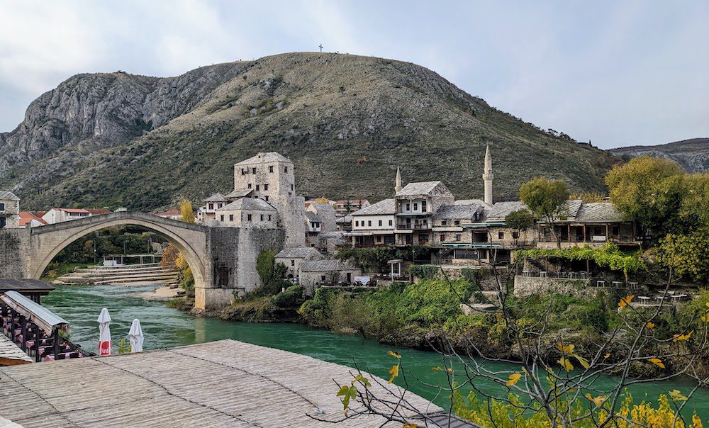 Mostar bridge and old town around the river.