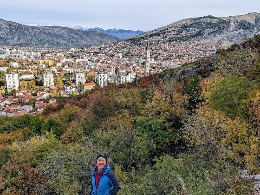 woman hiking above Mostar, Bosnia and Herzegovina in fall