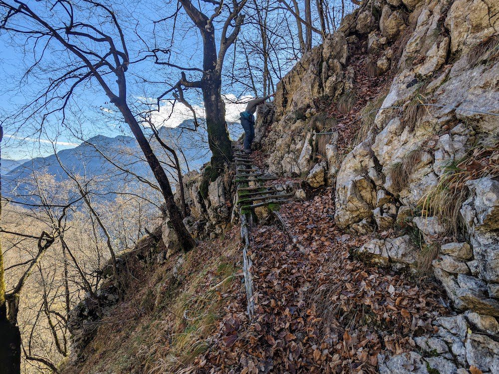 Woman navigating a very sketchy bridge. One of many we encountered on our hike.