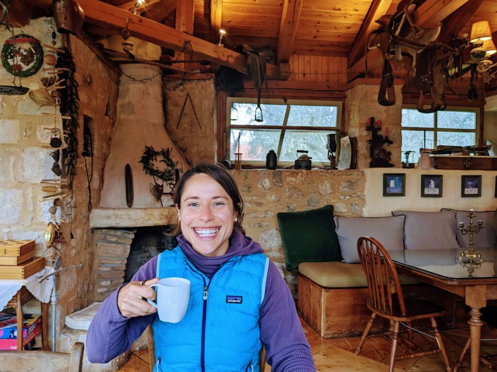 Woman drinks coffee in a old fashioned dining room