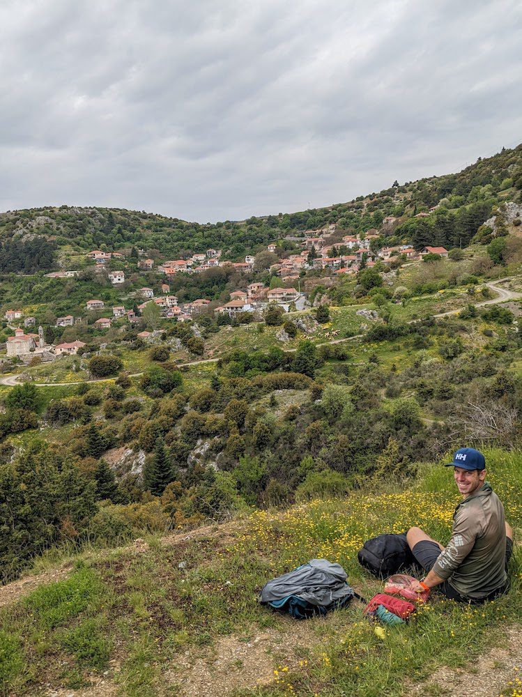 a man eating a snack along the Menalon Trail