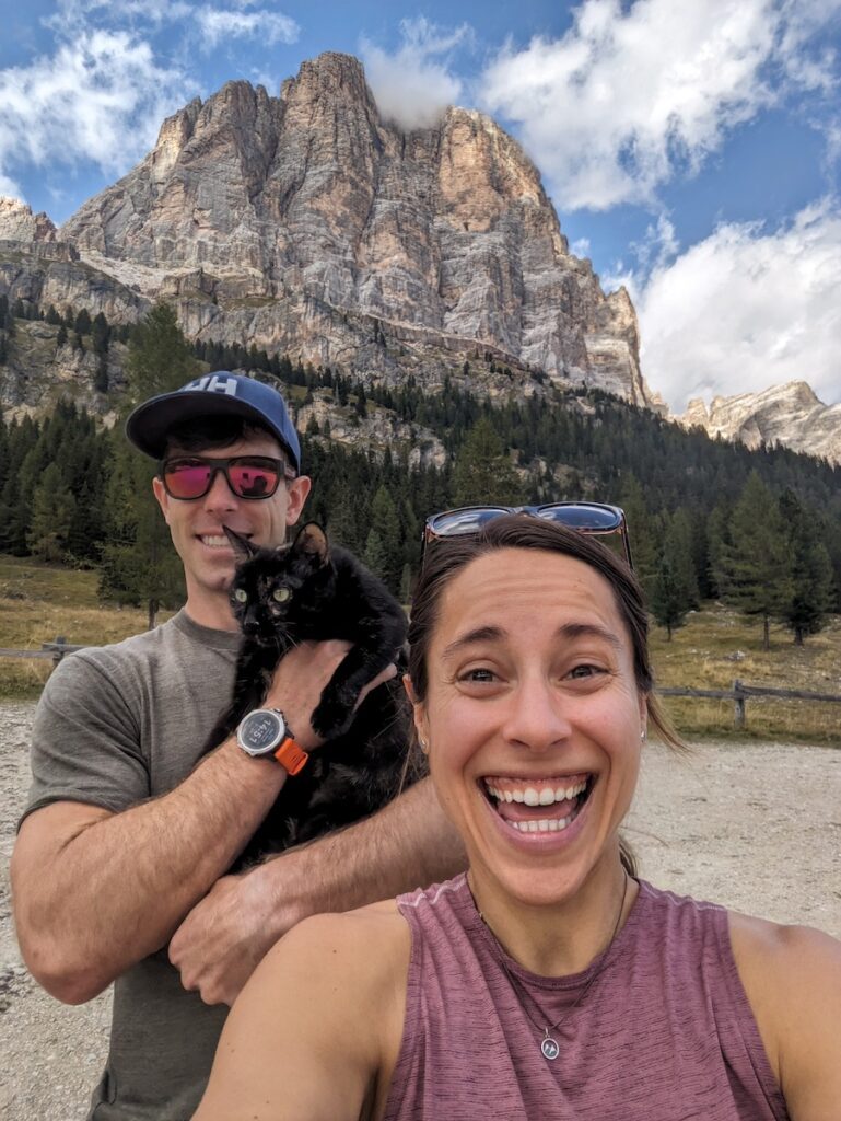 a couple and a cat in the dolomites