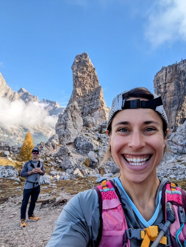 a couple hiking in the dolomites