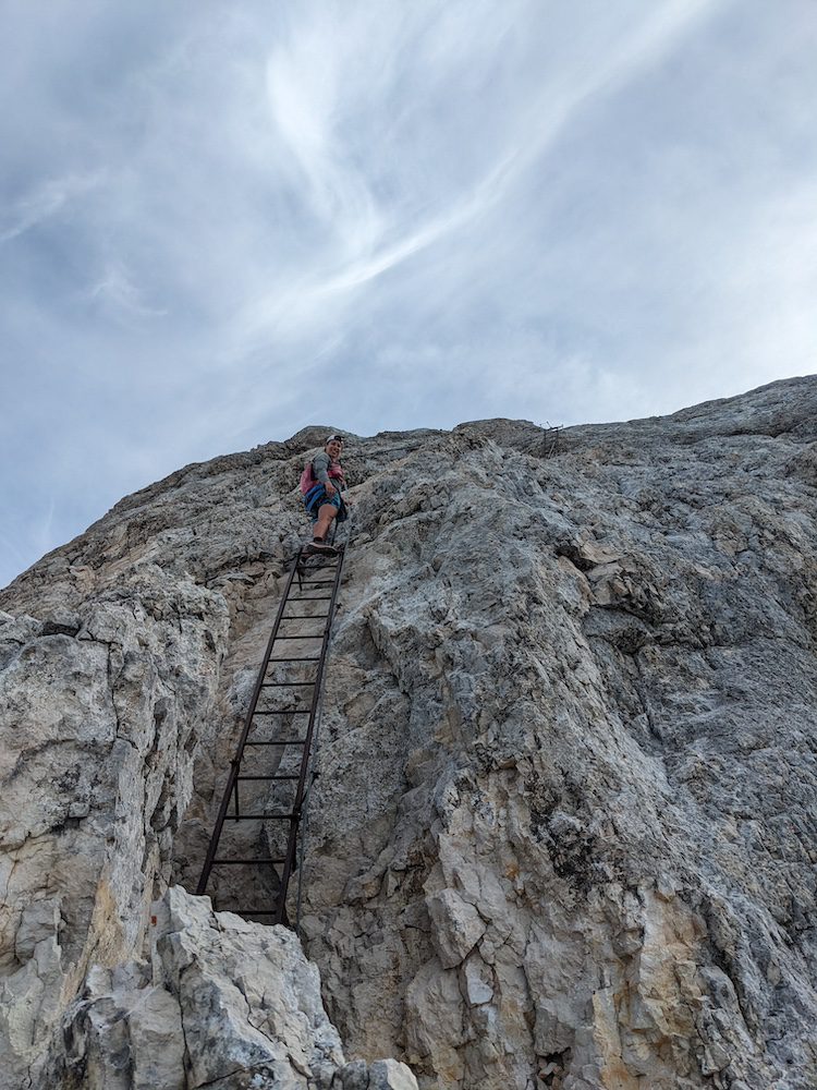 Rose climbing a ladder near the summit of Conturines